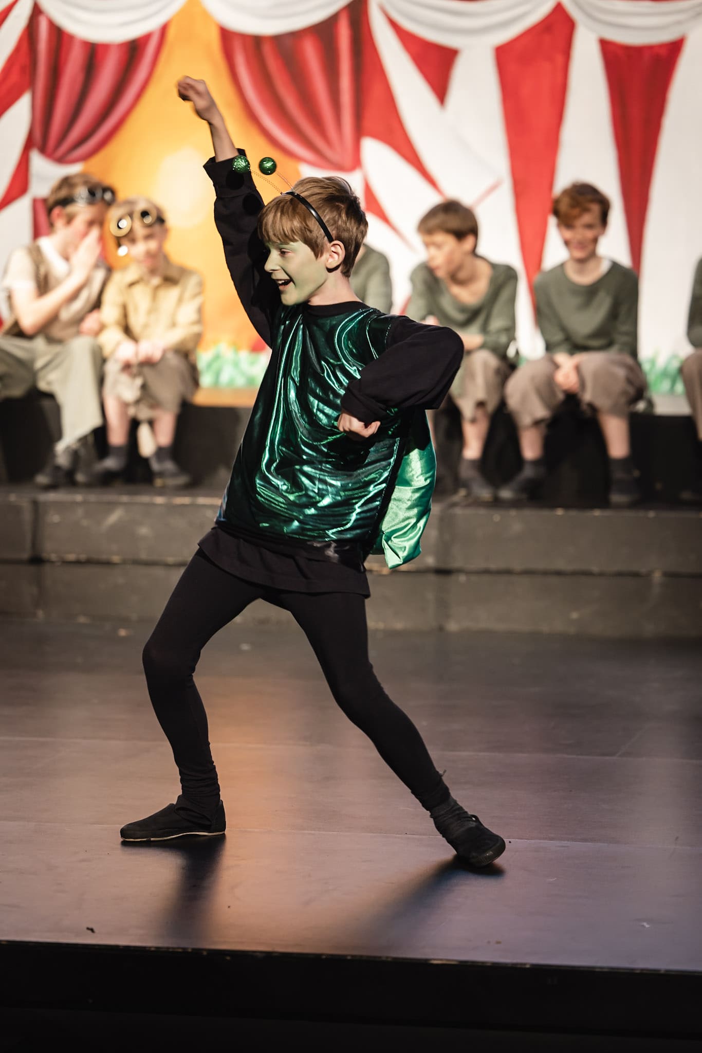 Boy dancing on school stage