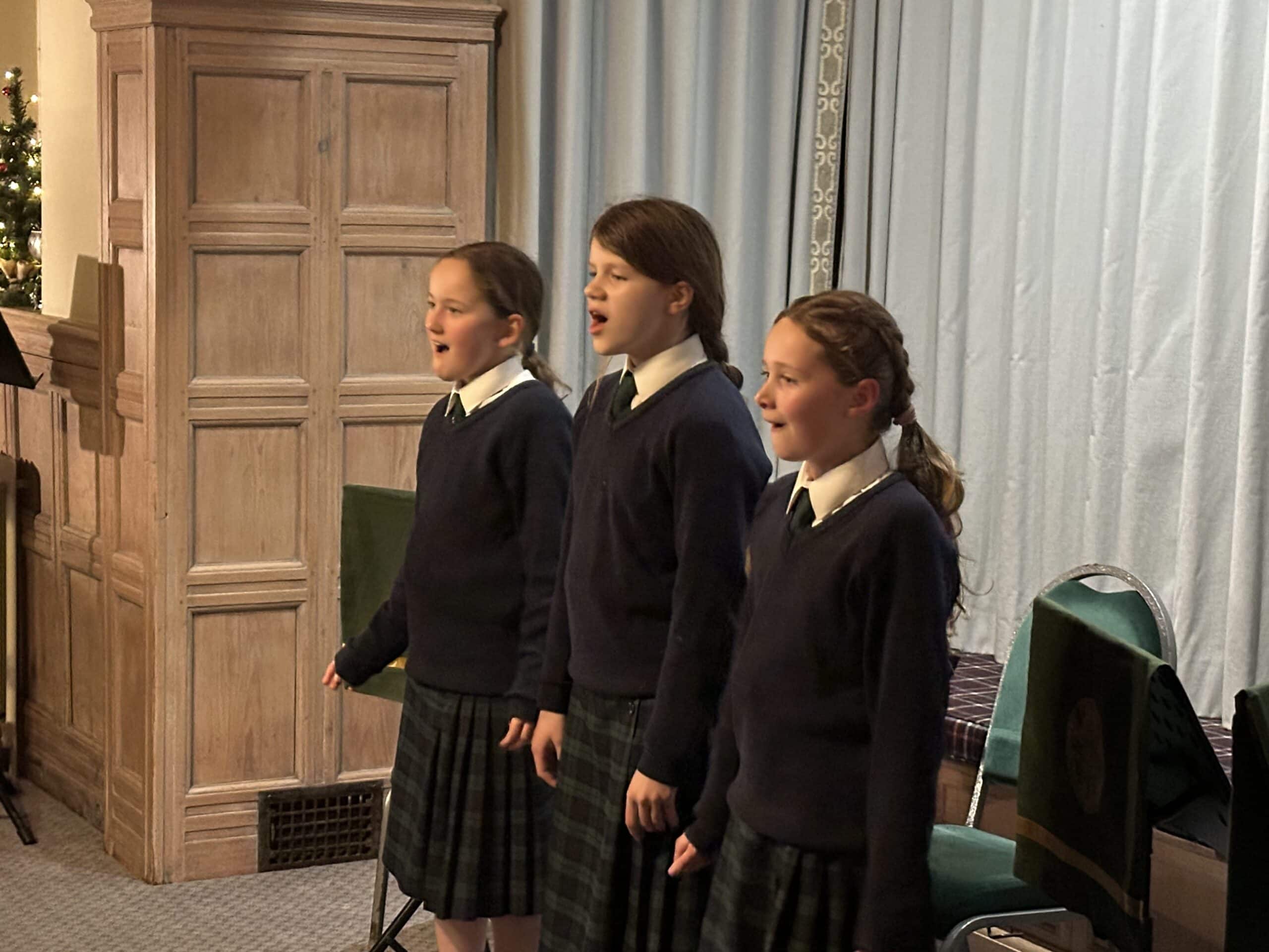 Three girls singing