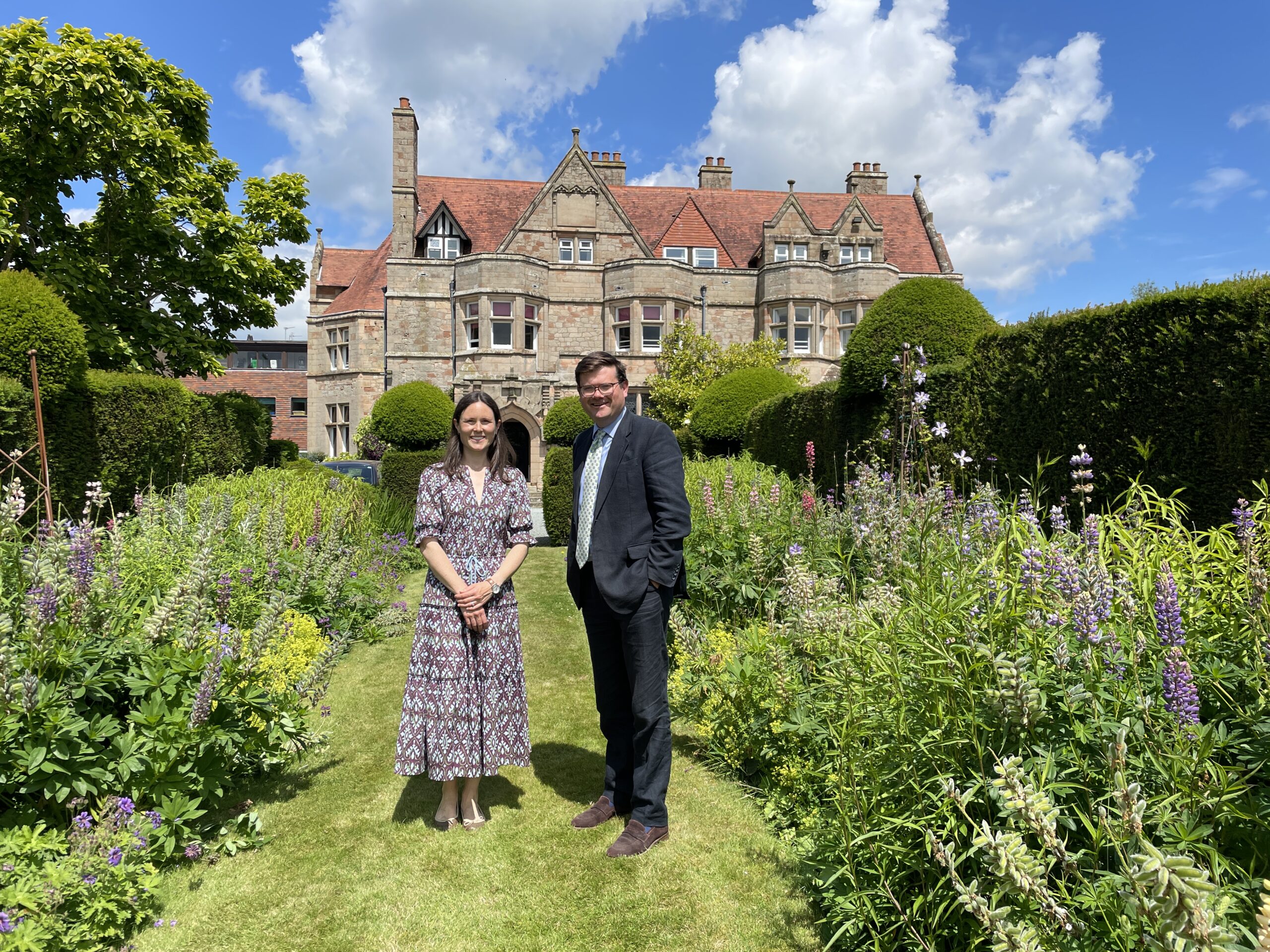 Packwood Head and Head of Admissions stood on beautiful lawn outside school