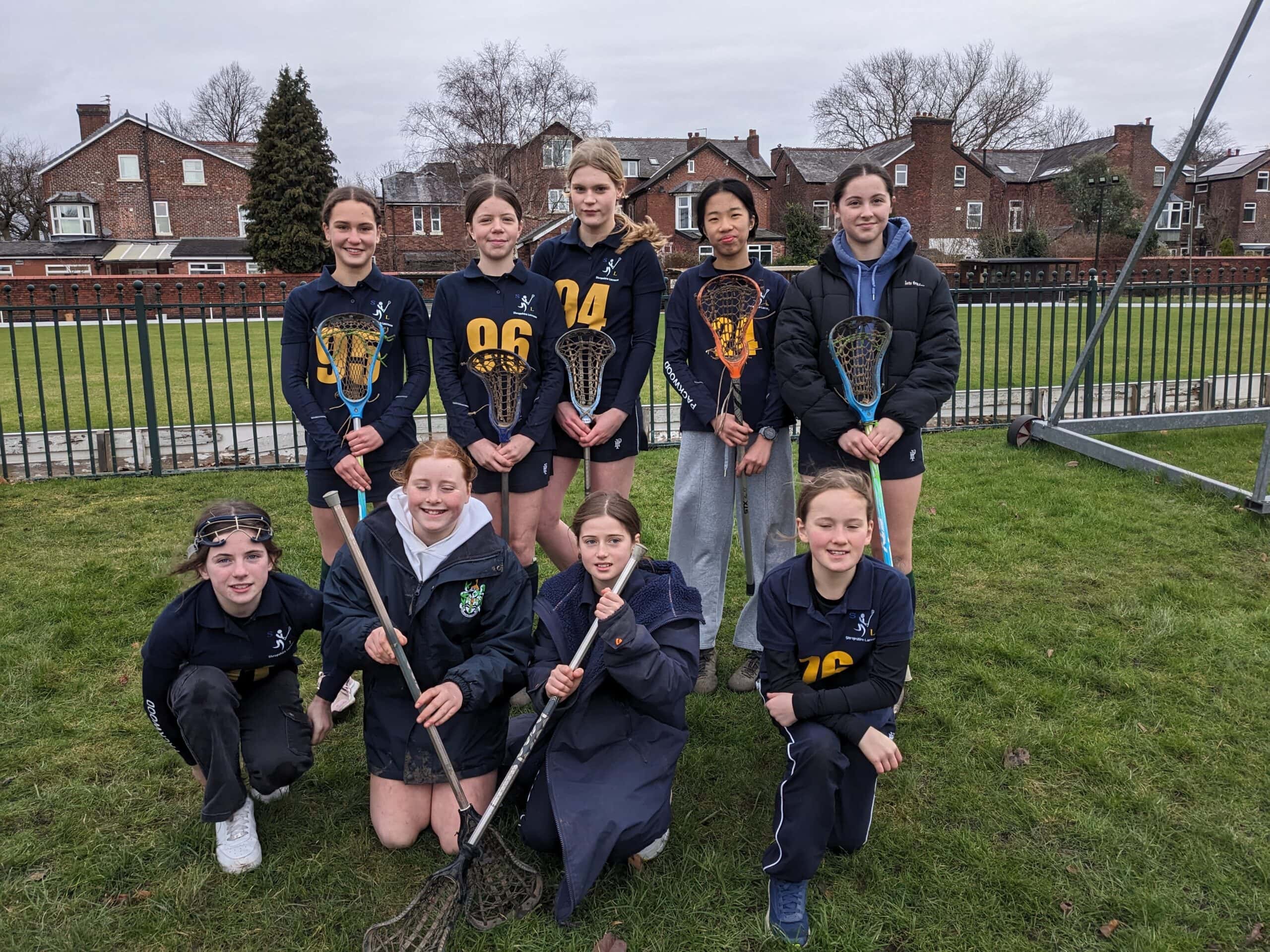 Nine lacrosse players ready for their match